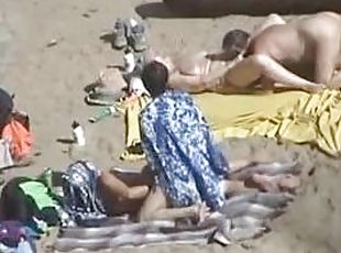 Girl gets her pussy fingered by her husband on a nude beach
