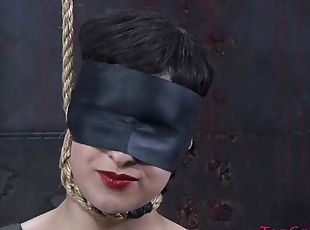 Blindfolded chick with a short hair getting tortured in the basement