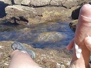 Jerking off a Big Hard Dick overlooking the sea in the Public cove until he cums
