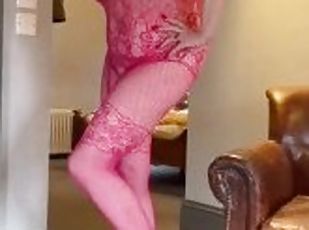 Pink bodystocking and heels