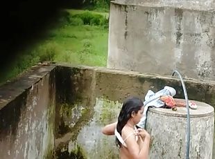 Indian Village Girl Bathing Near Water Tank Outdoor