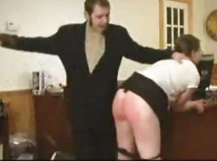 Cute girl in glasses cries out during spanking