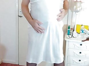 Redhead sexy tgirl in white satin and stockings