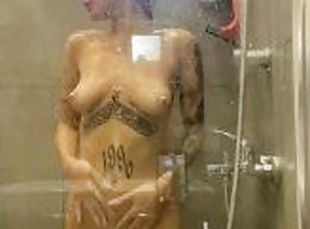 Beautiful girl takes a shower